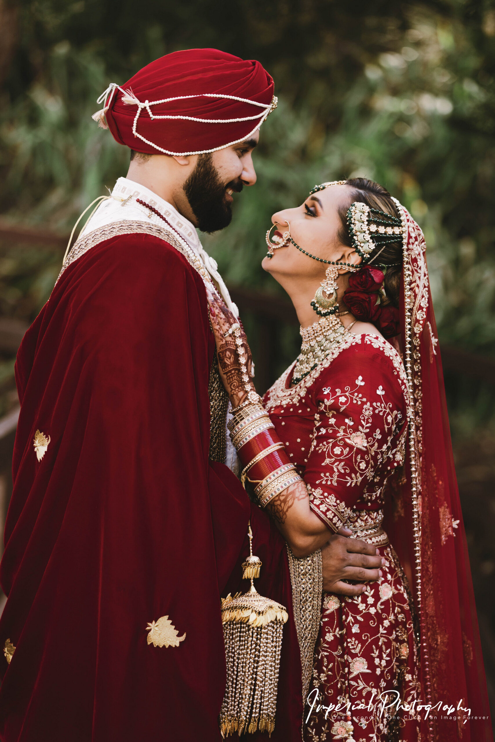 "Imperial Photography's romantic shot of a bride and groom during their first dance" "Elegant bridal portrait captured by Imperial Photography's team" "Imperial Photography's team's candid shot of a wedding party laughing together" "Stunning sunset captured during Imperial Photography's outdoor wedding shoot" "Imperial Photography's team's artistic close-up of a bride's bouquet" "Imperial Photography's team's capturing the groom's reaction as the bride walks down the aisle" "Imperial Photography's team's capturing the intimate moment of the couple's kiss during the ceremony" "Imperial Photography's team's capturing the family and friends raising a toast to the newlyweds" "best indian photographer in perth"